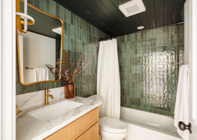 Boutique Bathroom Refresh — Green Tile Feature, Brass Accents, and a Clean Modern Finish
